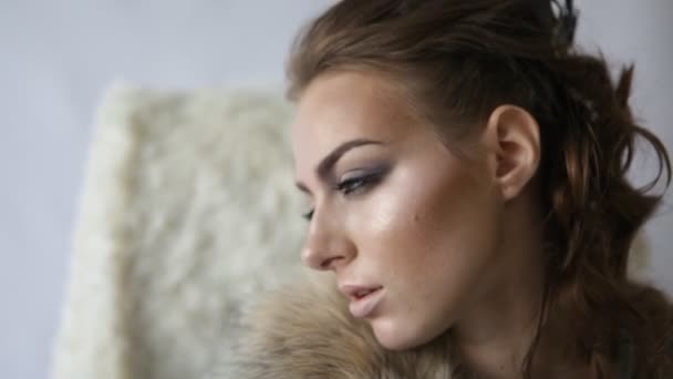 close-up portrait of thoughtful model with crown looking at camera and posing - Footage, Video
