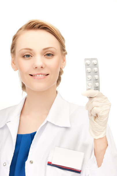 Attractive female doctor with pills - Photo, image