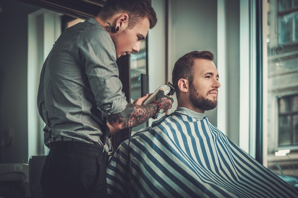 man visiting hairstylist in barber shop. - Zdjęcie, obraz