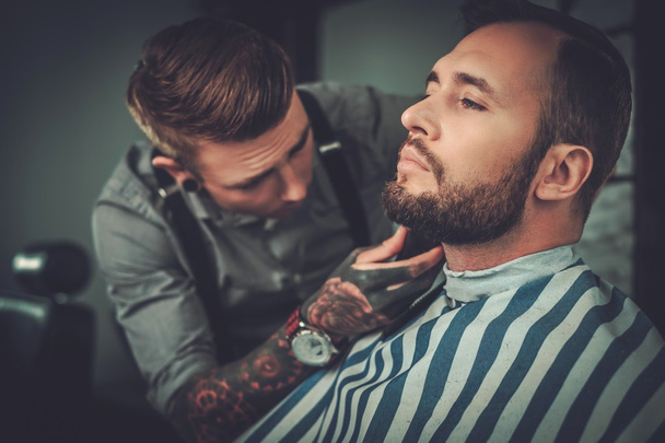 man visiting hairstylist in barber shop. - Photo, Image