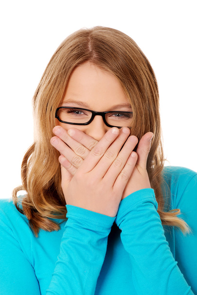 Teenager covering her mouth - Photo, Image