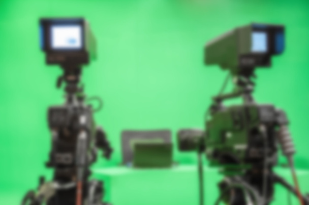 blur image TV camera in studio a green - Photo, Image