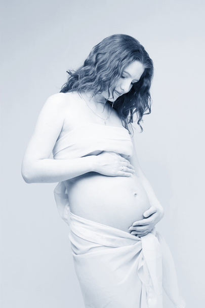 Pregnant woman in blue tone - Foto, imagen