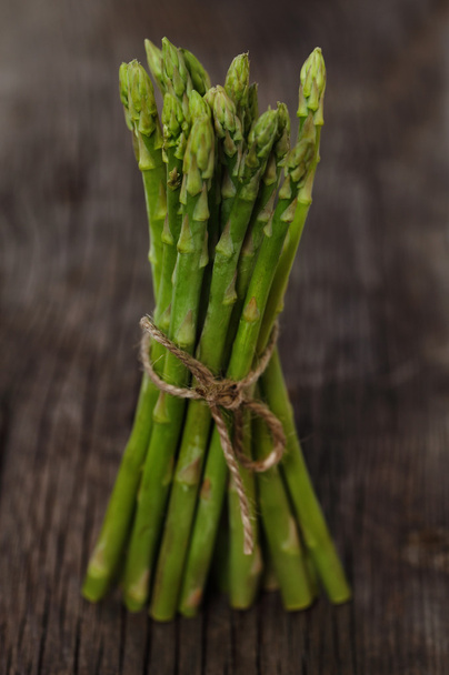 Bunch of fresh green asparagus spears - Фото, изображение