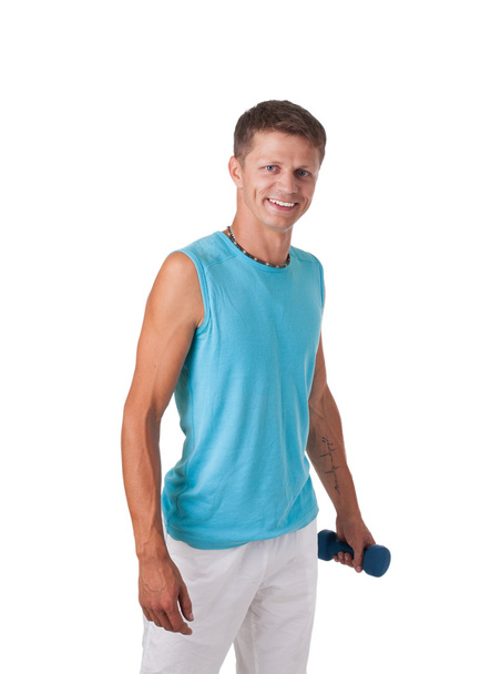 A muscular man with dumbbells in hand isolated on white - Valokuva, kuva
