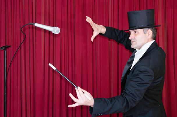 Magician performing flying microphone - Photo, Image