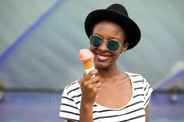 young black woman eating icecream - Фото, изображение