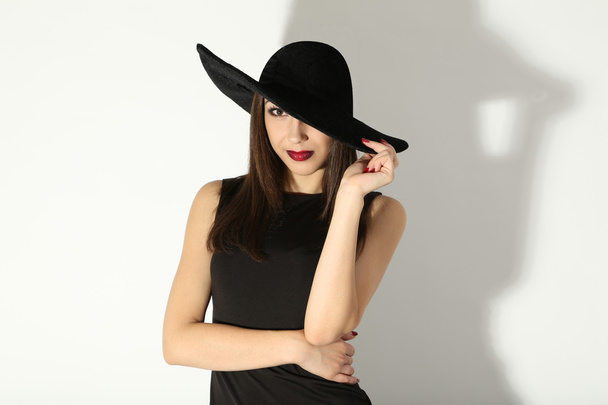 woman in black dress and hat - 写真・画像