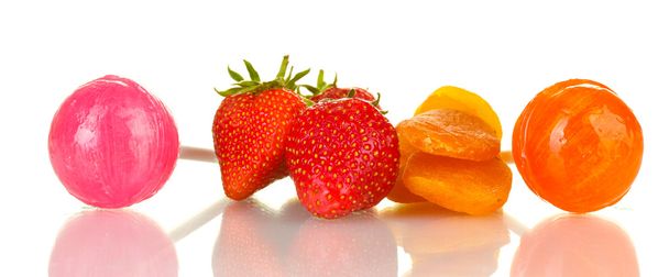 Lollipops strawberry and dried apricots isolated on white close-up - Foto, afbeelding
