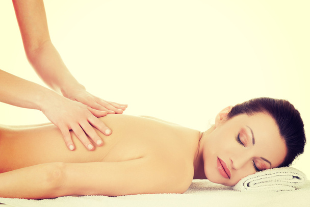 Woman relaxing beeing massaged in spa saloon - Fotó, kép