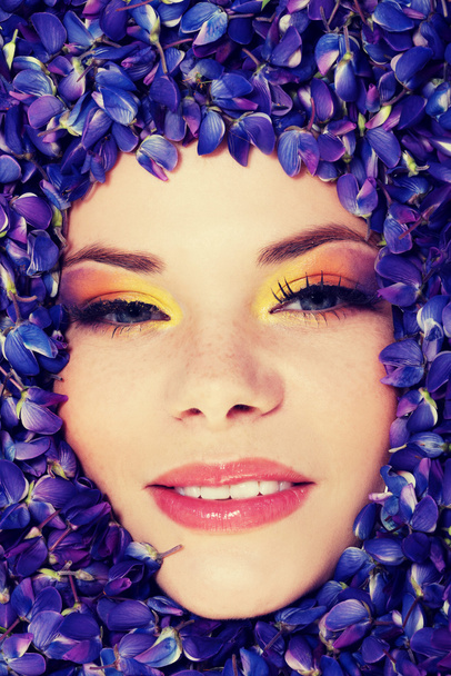 Beutiful young woman with colorful makeup - Фото, изображение