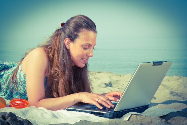 Woman Working at Computer on the Beach - Fotó, kép