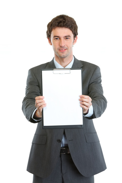Modern businessman showing blank clipboard - Фото, зображення