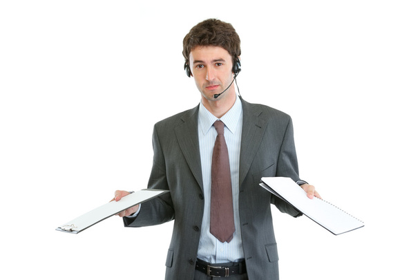 Business operator with headset confused in pile documents - Фото, зображення