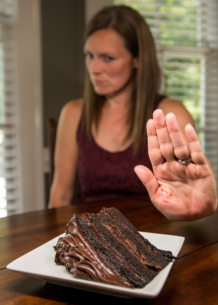 Woman Turning Down Chocolate Cake - Photo, Image