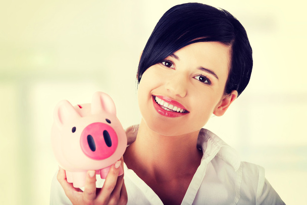 Happy business woman with her savings - Foto, Imagem