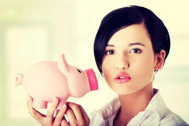 Happy business woman with her savings - Photo, image