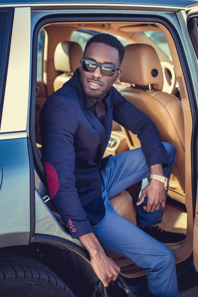 African male posing in a car - Фото, изображение