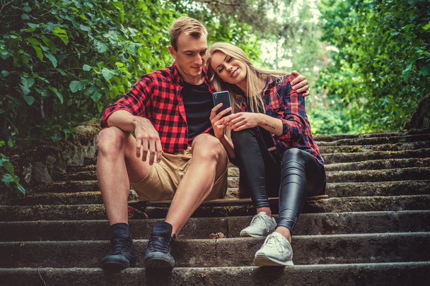 Casual young couple relaxing on stairs - Foto, immagini