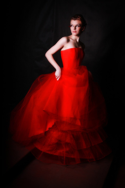 Beautiful girl in a gorgeous red crinoline - Photo, image