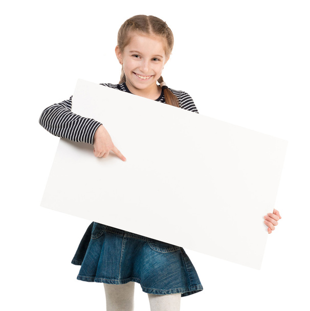 pretty schoolgirl with blank sheet in hands - Foto, afbeelding