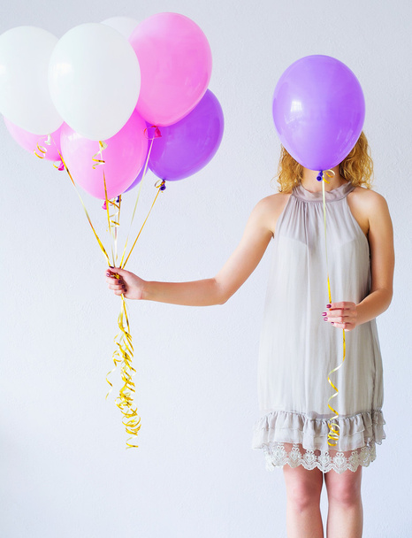 Woman behind bunch of balloons - Foto, Bild