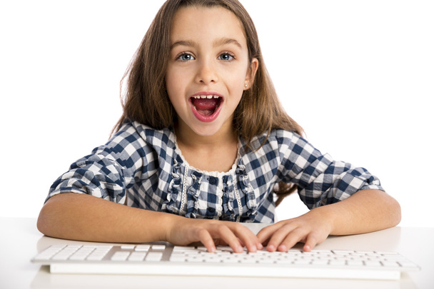 Little girl working with a computer - Foto, Imagem