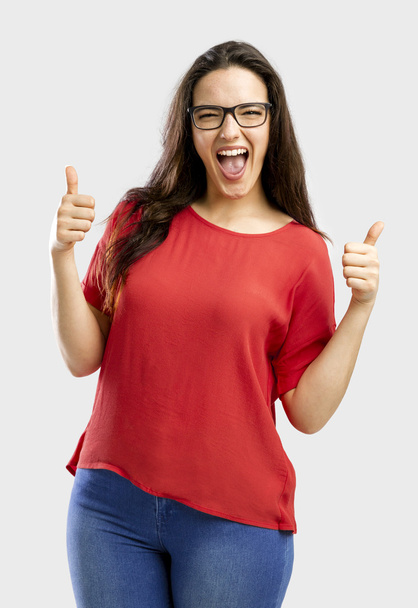 Happy woman with thumbs up - 写真・画像