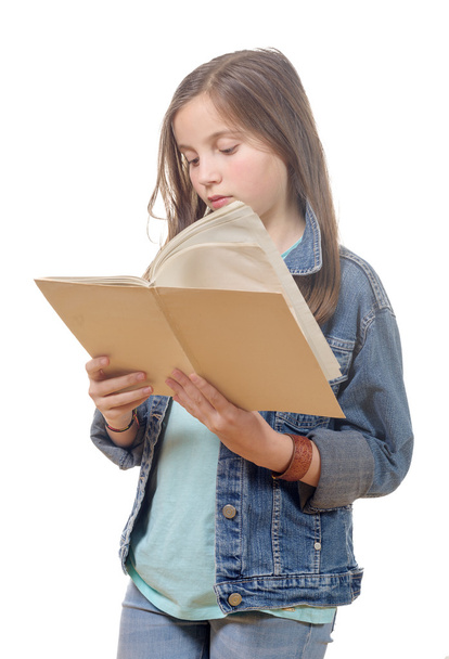 preteen girl reads a book - 写真・画像