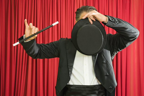 Magician hiding face with hat - Photo, Image