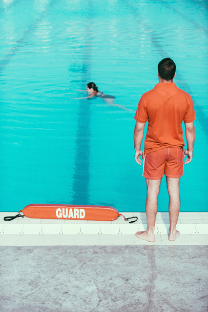 Lifeguard standing on duty - Photo, Image