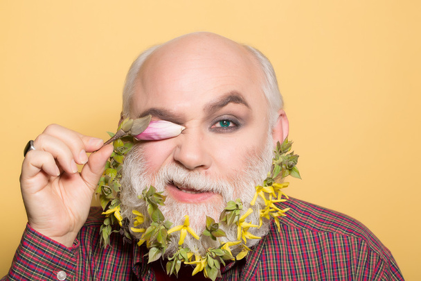 old man with flowers and leaves in beard - Foto, Imagem