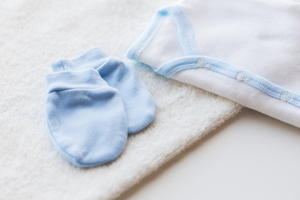close up of baby boys clothes for newborn on table - Фото, зображення