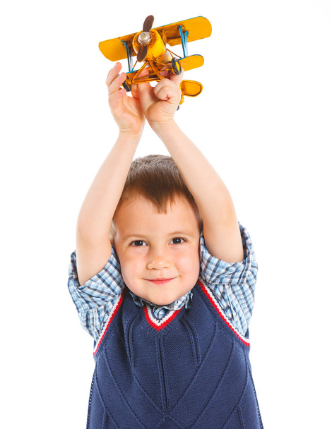 Cute little boy playing with a toy airplane - Photo, Image