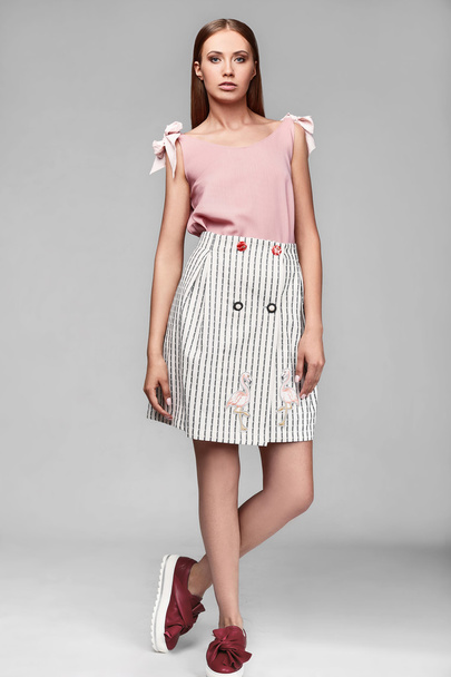 Portrait of fashion stylish swag young woman in skirt - Photo, Image