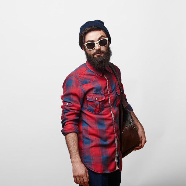 happy young bearded man in eyeglasses with backpack - Фото, изображение