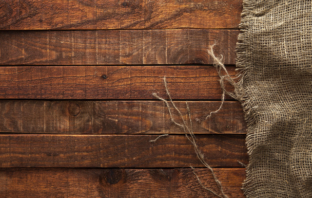 Dark wood with old burlap texture, top view - Photo, Image