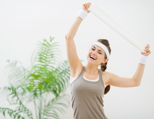 Portrait of happy fitness woman with towel - Foto, Imagem