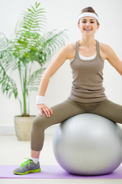 Fitness woman sitting on fitness ball - Fotó, kép
