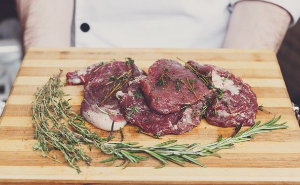 fresh beef meat on a cutting board - Fotó, kép
