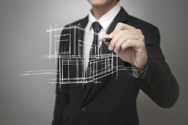 Бизнесмен рисует модель дома
 - Фото, изображение