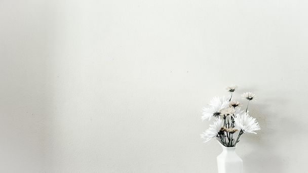 Some minimal flowers in the vase on white background. - Photo, image