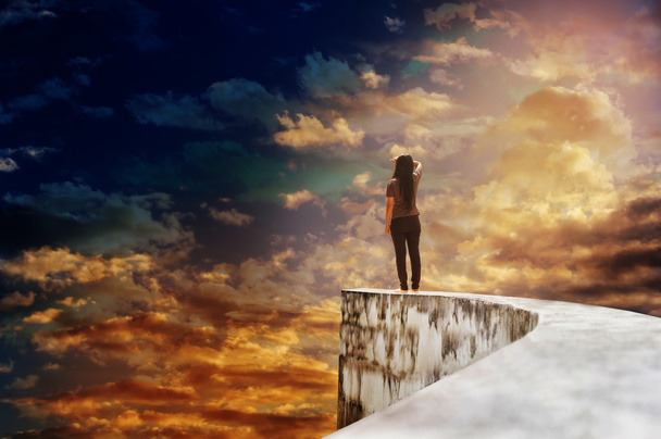 Women on dead end way high up on vast sky - Photo, Image