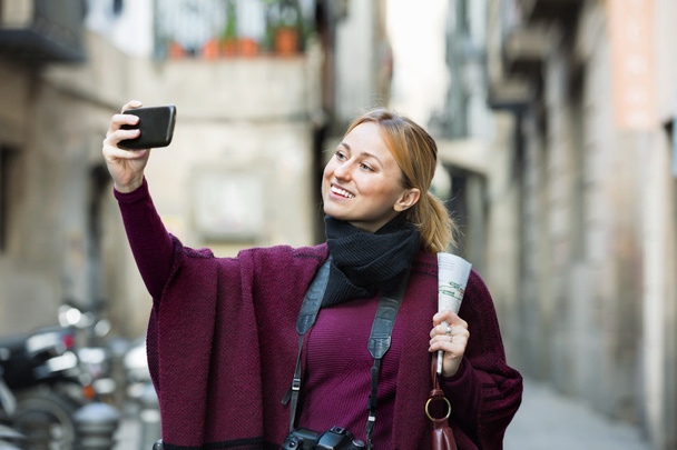 Girl taking picture with her phone - Photo, Image