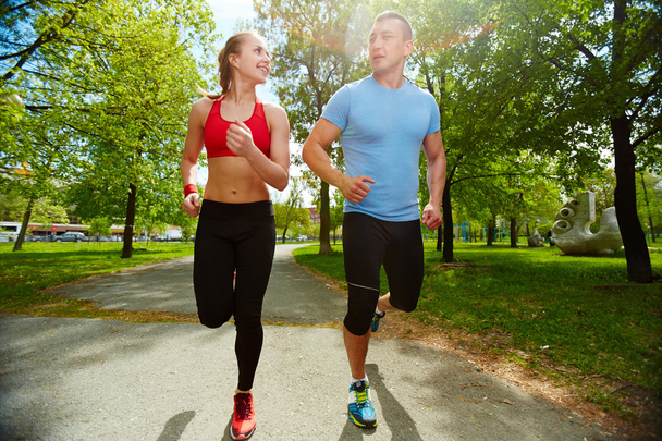 Sporty couple running - Photo, Image