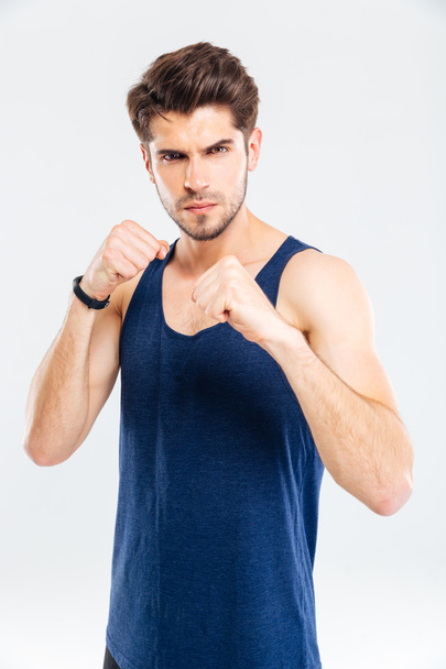 Portrait of a muscular male fighter standing - Photo, Image