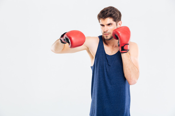 Portrait of a sports man boxing in red gloves - Foto, Bild