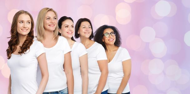 group of happy different women in white t-shirts - Fotó, kép