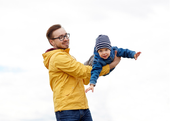father with son playing and having fun outdoors - Фото, изображение