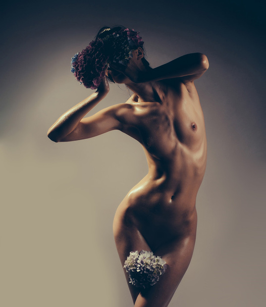 sexy naked woman with hydrangea flowers - Fotó, kép